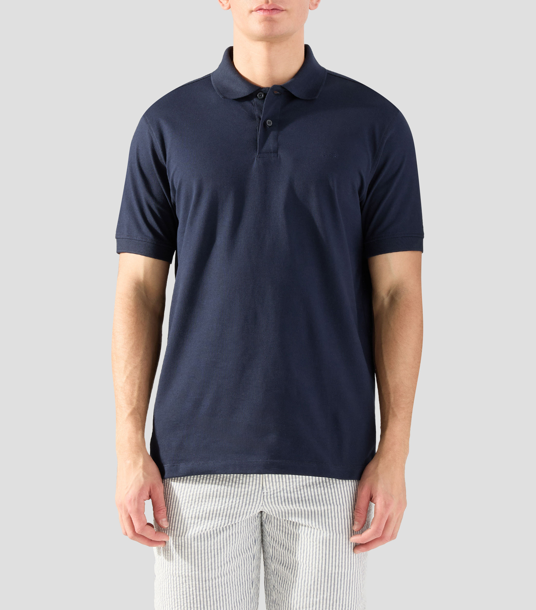 Playera tipo polo con manga corta lisa Hombre